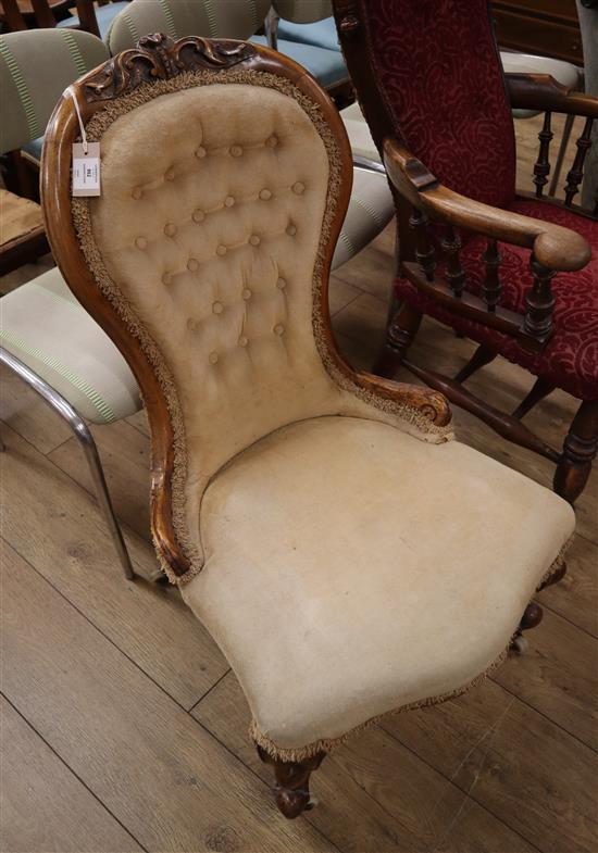 A Victorian walnut spoon back nursing chair